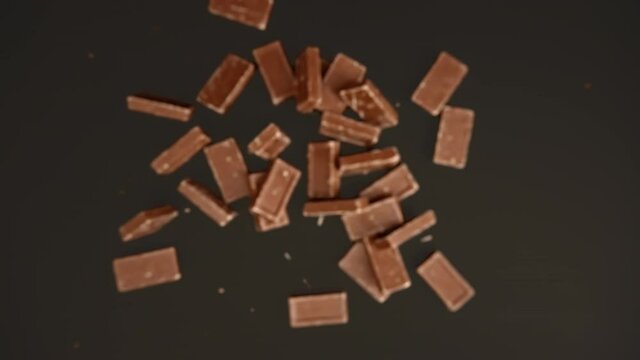 Slow motion of chocolate bar on a black background