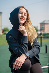 Portrait of an attractive athletic woman in a hood