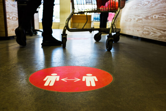 Red round circle sign printed on supermarket grocery store floor