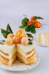 Cut sponge cake with mandarin cream.