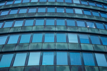 Fototapeta na wymiar windows in a modern house. Exterior view of Finnish offices in Glass and metal buildings.