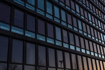 windows in a modern house. Exterior view of Finnish offices in Glass and metal buildings.