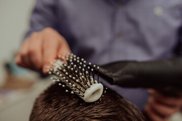 Naklejka premium Young Man in Barbershop Hair Care Service ConceptYoung Man in Barbershop Hair Care Service Concept