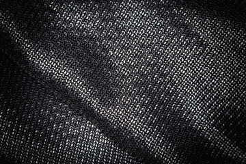 Close up of Black wavy fabric abstract background.
