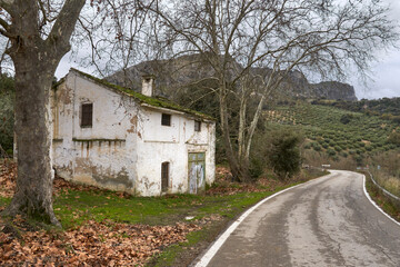 Fototapeta na wymiar road and house in the natural park of the Subbetic mountains in Cordoba. Spain