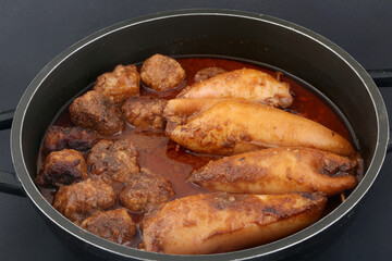 stuffed squid cooked with sauce and meat balls