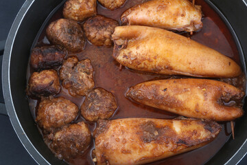 stuffed squid cooked with sauce and meat balls