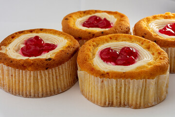 Sponge cake with cream and decorated with berries. A cake in the form of a basket with whipped cream.