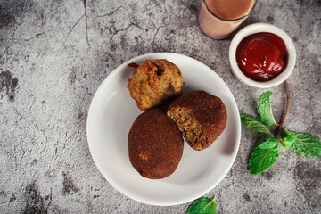 Homemade  Beef Cutlets - Kerala snacks served with tea, selective focus