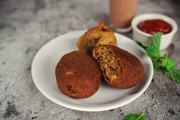 Homemade  Beef Cutlets - Kerala snacks served with tea, selective focus