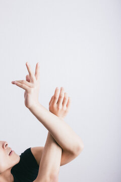 A male dancer's hands twisting and warming up