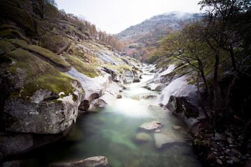 waterfalls of a mountain river in autumn focus selected
