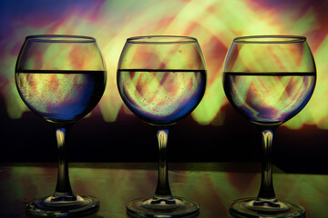 3 glasses of wine in a row on a beautiful background