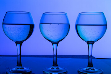 3 glasses of wine in a row on a beautiful background