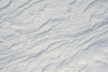 Fresh clean white snow background texture. Winter background with frozen snowflakes and snow mounds. Snow lumps. Seasonal landscape details. Cold weather.