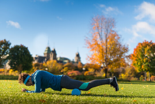 Young Woman Stretching After Jogging In Ottawa Park Near Parliament Hill