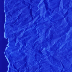 Cardboard blue abstract pattern texture close-up. Retro old paper background. Grunge concrete wall. Vintage blank wallpaper.