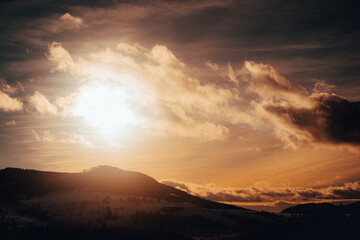 Winter orange sun in the mountains. View in the mountains.