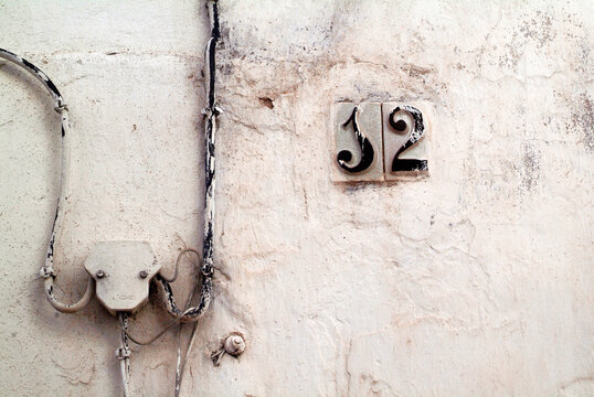 streets numbers on old grungy facades