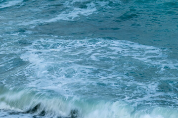 beautiful, blue sea with waves, foam on a nice, warm day in the tropics travel, vacation, walk