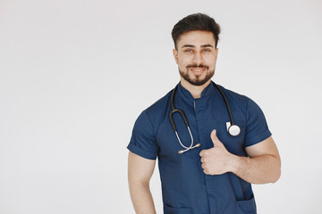 International medical student. Man in a blue uniform. Doctor with stethoscope.