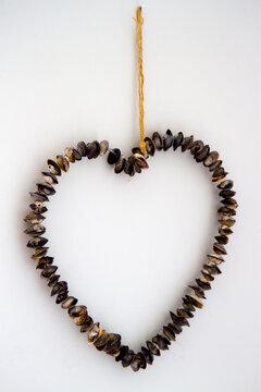 A hanging heart made from seashells