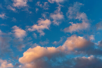 evening blue sky with golden clouds as natural background