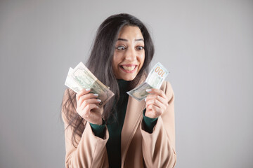 happy woman holding money