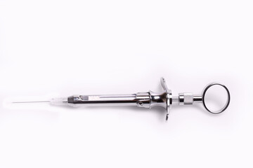 Metal syringe isolated on white background