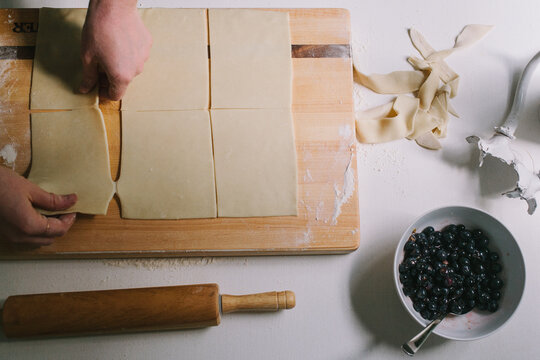 Women Pulling Dough Apart