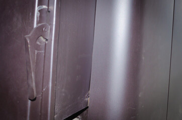 Door of a metal stove in a bathhouse, sauna.