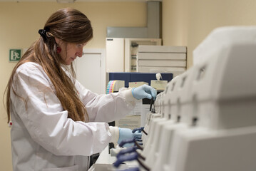 Female scientist on a laboratory of genetic research with a DNA chip
