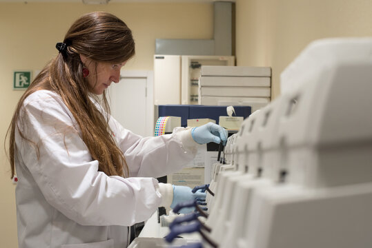 Female scientist on a laboratory of genetic research with a DNA chip