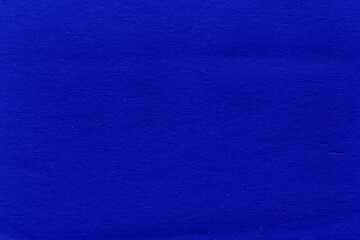 Cardboard blue abstract pattern texture close-up. Retro old paper background. Grunge concrete wall. Vintage blank wallpaper.