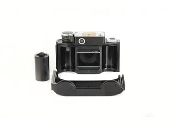 Old 35mm bakelite scaling film camera on white background.