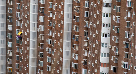 Swarm of houses in a huge urban building
Conglomerate of windows and exterior balconies that adorn...