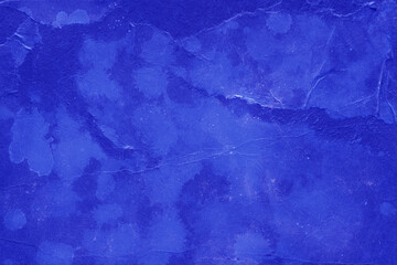 Cardboard blue abstract pattern texture close-up. Retro old paper background. Grunge concrete wall. Vintage blank wallpaper.