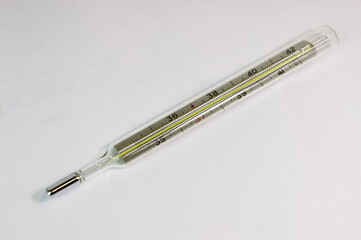 thermometer close up. medical device for measuring body temperature. thermometer on a white...