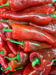 Red sweet peppers at a farmers market.