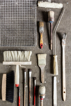 Variety of painting tools on a stone background