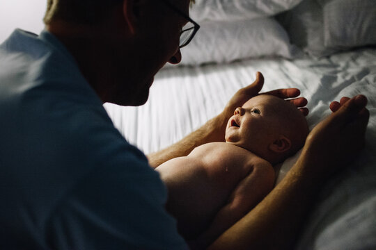father and baby bonding at bedtime