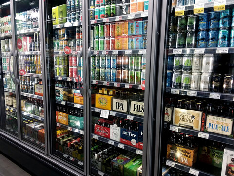 Seattle, WA / USA - June 29st, 2019: Beer and liquor fridge display inside a Whole Foods grocery store.
