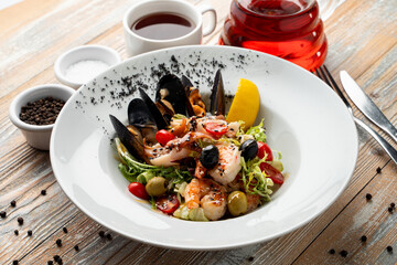 Luxury muscled salad on light wooden table, beautiful magazine shot