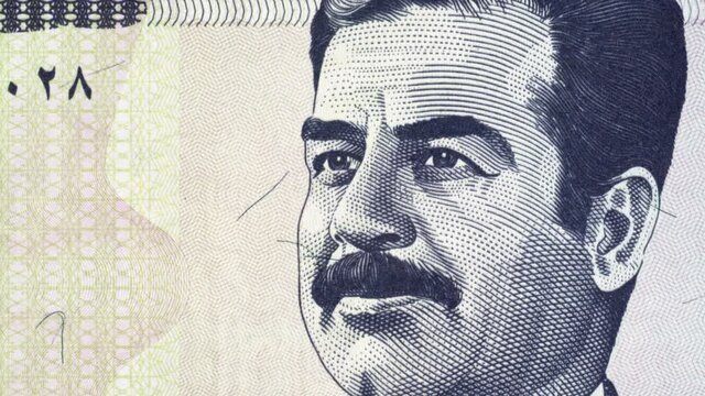 Saddam Hussein on Iraqi 100 dinar (2002) banknote tracking. Leader and president of Iraq. Slider shot