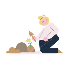 Woman gardener sitting on knees and taking care of soil for putting seedlings