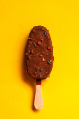 chocolate ice cream on the yellow background