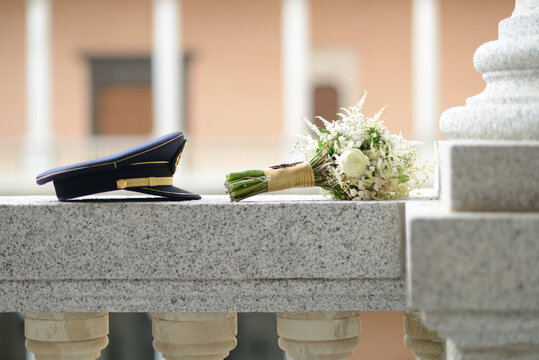 Wedding favors with Spanish civil guard cap and bridal bouquet with white flowers