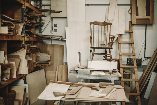 untidy wood workshop with a comfortable swing chair