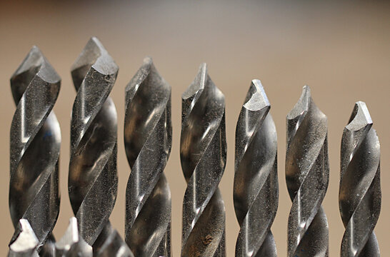 Row of dusty drill bits at a wood workers shop