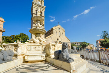 Fototapeta na wymiar Messina Cathedral on the Mediterranean island of Sicily, Italy. Reclining marble figures and a sphinx highlight the Fountain of Orion
